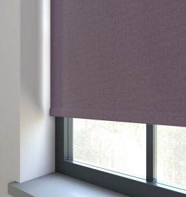 Our Amor Damson Roller blind in a living room window.