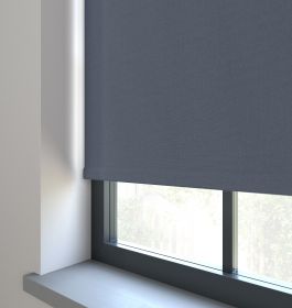A blue roller blind in a living room window 