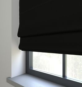 Our Prestige Silk Midnight Roman blind in a bedroom window