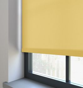 Our Burst Pastel Yellow Roller blind in a living room window.
