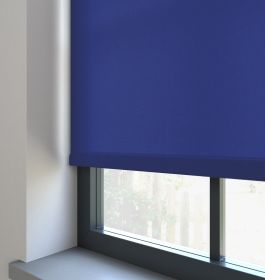 Our Burst Navy Blue dimout roller blind in the living room.