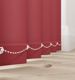 A rich red vertical blind in a bathroom