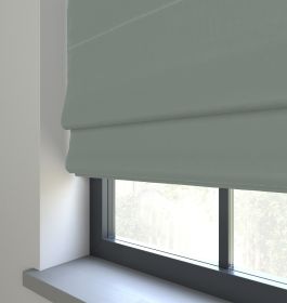 Our Prestige Silk Delicate Teal Roman blind in a living room window