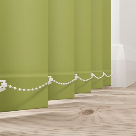 A green vertical blind in a living room
