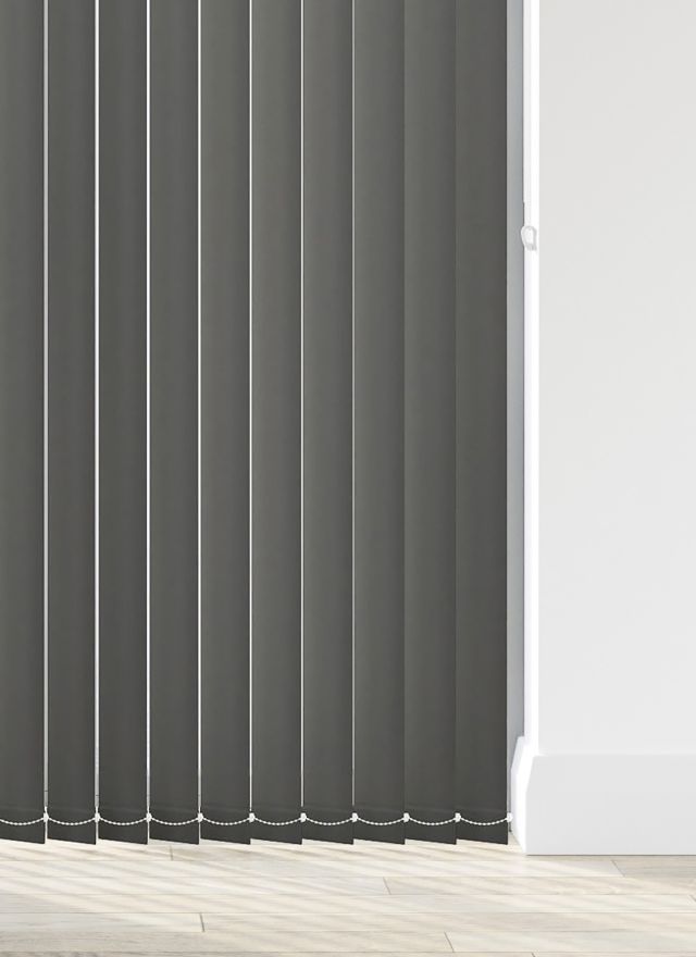 A black coloured vertical blind in a bathroom