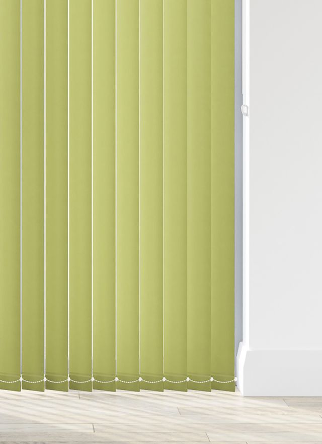 A green vertical blind in a living room