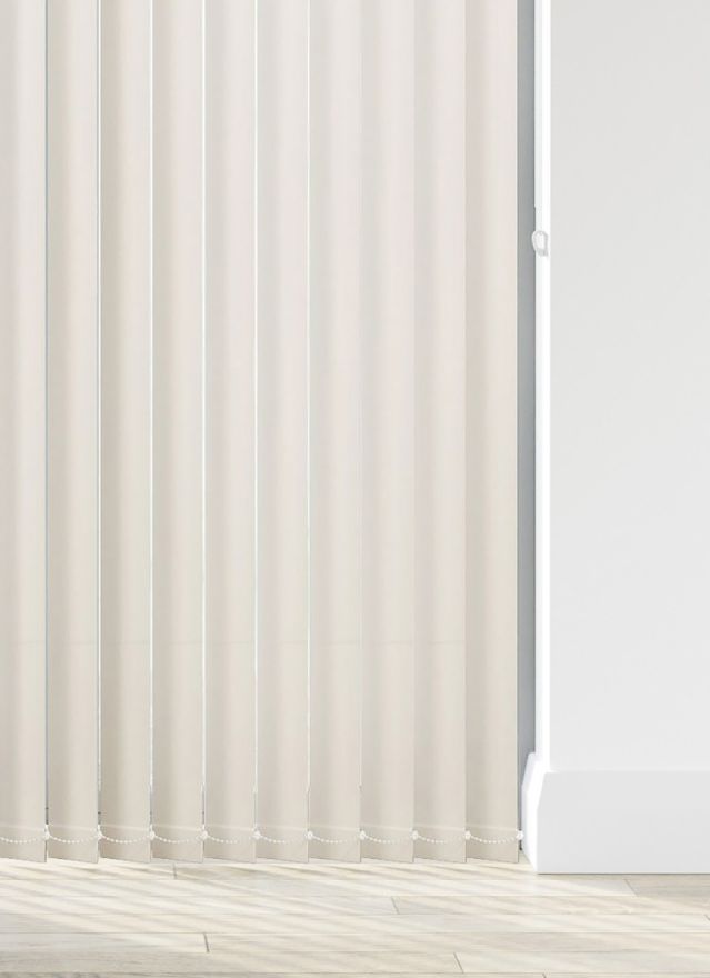 A cream coloured vertical blind in a bathroom