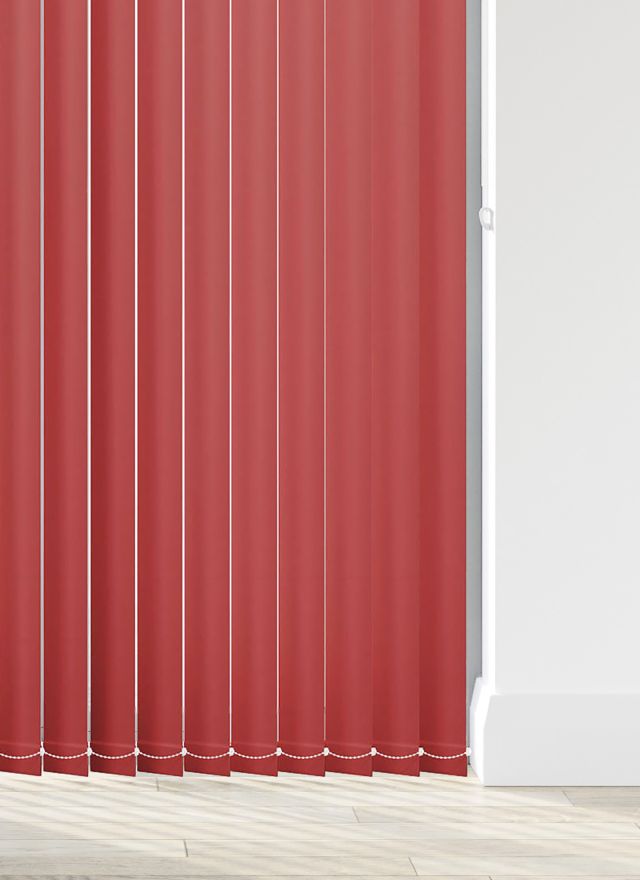 A red coloured vertical blind in a kitchen