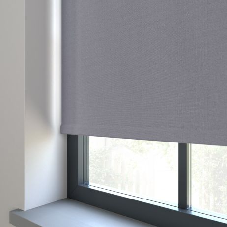 Our Amor Stormy Grey  Roller blind in a living room window.