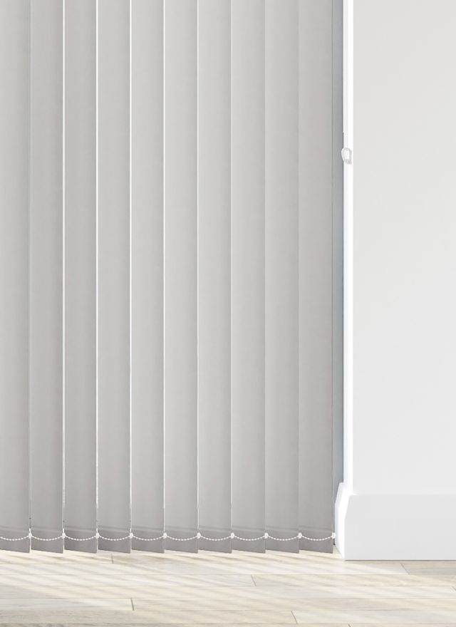 A white vertical blind in a bathroom window 