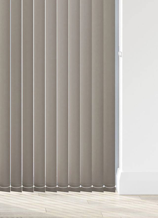 A dark grey vertical blind in a living room