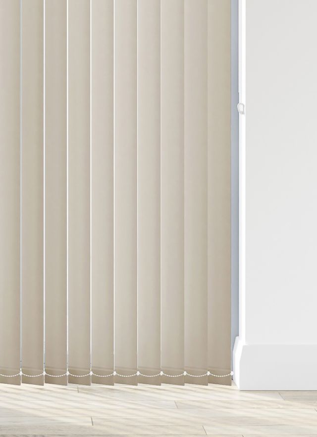 A cream vertical blind in a bathroom window 