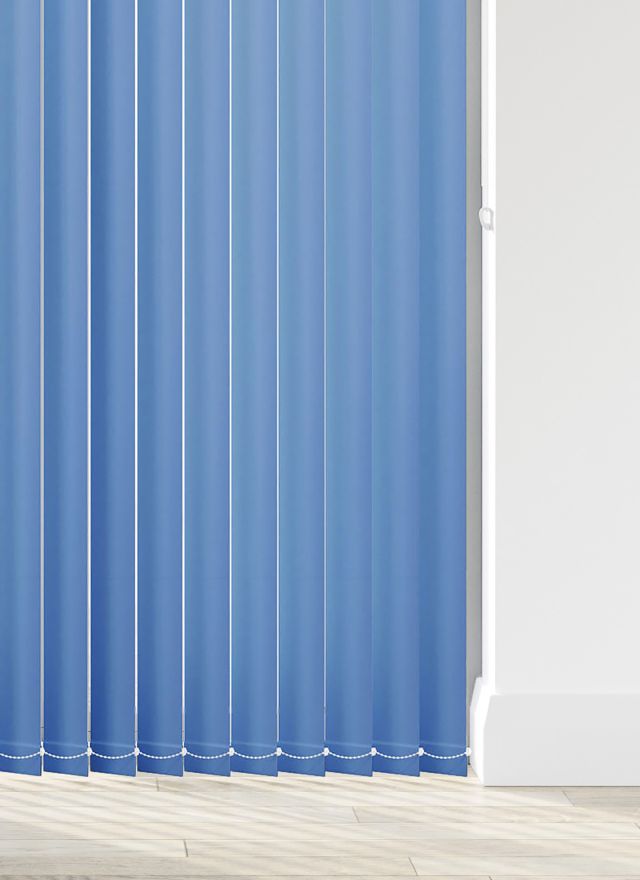 A rich blue coloured vertical blind in a kitchen