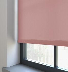 Our Burst Soft Peach dimout roller blind in the living room window.